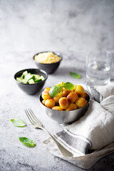 Fried potato gnocchi with cheese filling