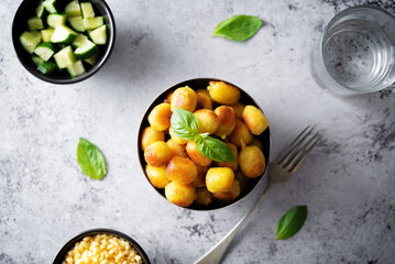 Fried potato gnocchi with cheese filling