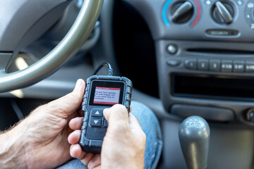 Using a car scan code reader for repair diagnostic and check engine test