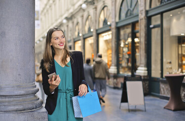 portrait of a young woman while shopping in the city