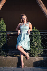 Portrait of young, teen girl in blue lace dress, ready for her prom night