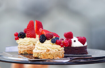 Mini fruit cakes, desserts for sale at the Naplavka farmers street food market on the waterfront of the Vltava River in Prague.