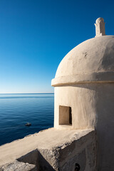 Old gun towers on the Dubrovnik city fortified walls looking on the horizon above Adriatic sea, Croatia