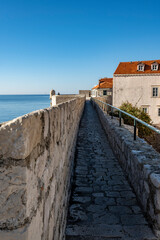 Fototapeta na wymiar Wonderful medieval fortified walls of Dubrovnik, Croatia, rising above the sea, set of popular TV show with knights and dragons