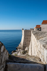 Fototapeta na wymiar Wonderful medieval fortified walls of Dubrovnik, Croatia, rising above the sea, set of popular TV show with knights and dragons