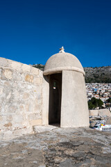 Fortified Dubrovnik city walls with gun towers now used as photoshooting background during tourist travels