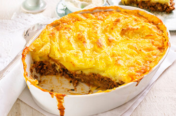 Traditional British shepherd's pie with minced meat and mashed potatoes served as close-up on a...