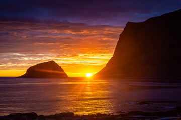 Incredible midnight sunset over the sea of Vik beach, Lofoten Islands,  Norway