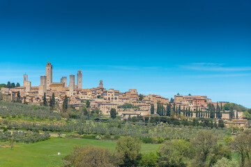 Fototapeta na wymiar Beautiful cityscape with the medieval towers of San Gimignano town in Tuscany, Italy