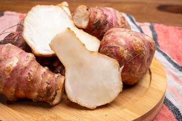 Group of fresh uncooked topinambur or Jerusalem artichoke roots