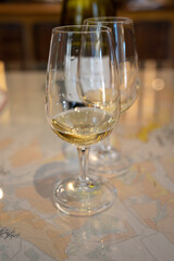 Tasting of white dry chablis wine in small winery in Chablis town, Burgundy, France