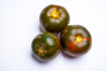 Fresh ripe sweet reddish brown and green kumato tomatoes