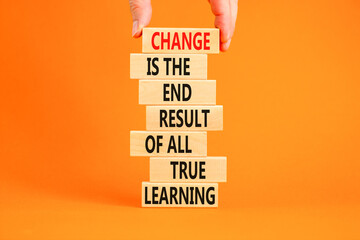 Change symbol. Concept words Change is the end result of all true learning on wooden blocks. Beautiful orange background. Copy space. Businessman hand. Motivational business change result concept.