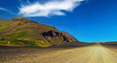 Typical icelandic dirt road in arid wild rugged rough landscape - Iceland, Highlands