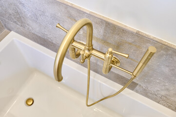 Gold Tube Faucet Shot from Above at an Angle - 573064088