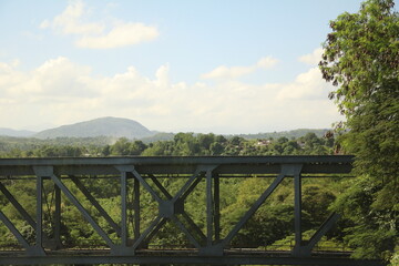 Fototapeta na wymiar Railway bridge over green landscape of Cuba, Caribbean