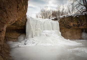waterfall in winter - 573066896