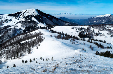 View from the mountain on the winter mountainous landscape