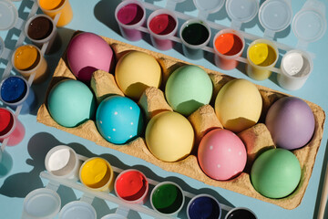 A tray with colored multicolored Easter eggs with a dot