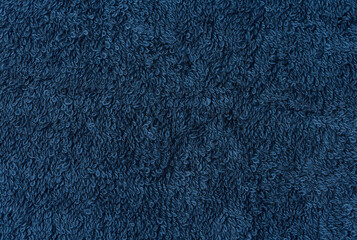 Texture of a blue terry cotton towel, canvas. Macro