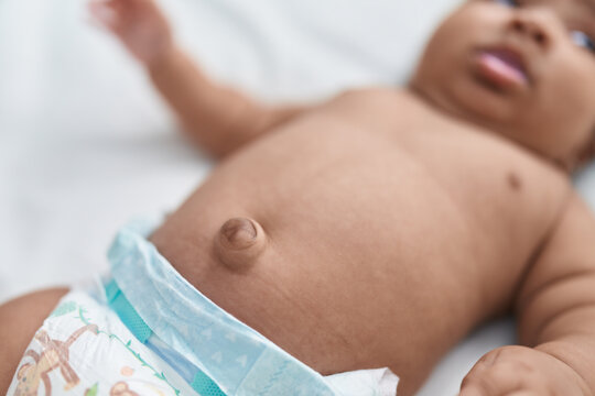 African American Baby Belly Button At Bedroom