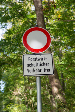 German warning sign forestry vehicles only on a street in the woods