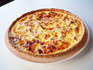 Homemade traditional french Quiche Lorraine, real recipe, white background