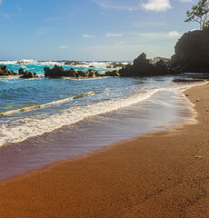 Red Sand And Blue Waves of Kaihalulu Beach, Hana, Maui, Hawaii, USA