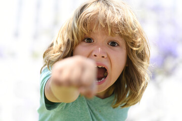 Enraged kid boy with angry expression. Angry hateful little rage boy, child furious. Angry rage...