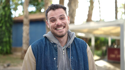 Young caucasian man smiling confident at park