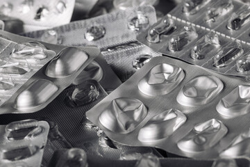 Empty silver blisters pack piled up in a heap