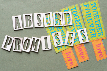 paradoxical sign: absurd promises and scrapbook paper tags with messages about love