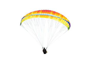 The sportsman flying on a paraglider. isolated on transparent background with clipping path. Beautiful paraglider in flight  with clipping path and alpha channel. for both printing and web pages. 
