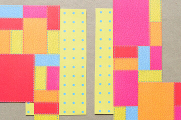 colorful scrapbook paper pieces with squares rectangles and dots
