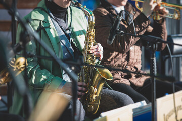 Concert view of a female saxophonist, professional saxophone player with vocalist and musical...