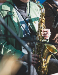 Concert view of a female saxophonist, professional saxophone player with vocalist and musical...