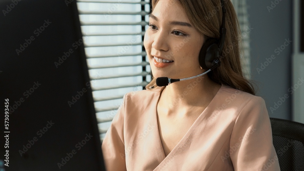 Aufkleber competent female operator working on computer and while talking with clients. concept relevant to bo