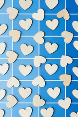 multiple scattered wood shapes on blue paper pad sheet with paint-chip style coloration