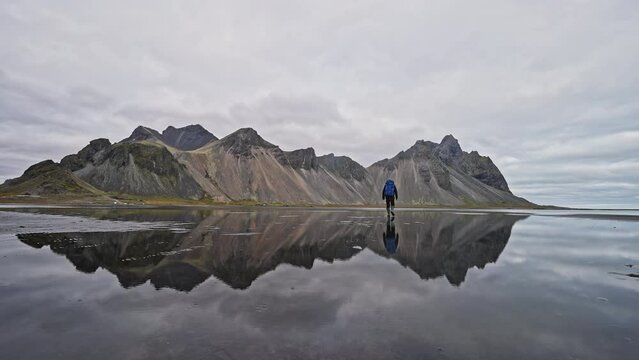 Man Walking Towards Vestrahorn Mountain