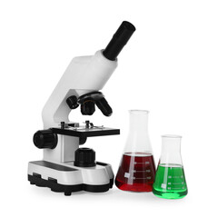 Laboratory glassware with colorful liquids and microscope isolated on white