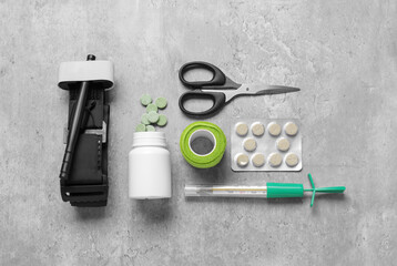 Flat lay composition with medical tourniquet on light grey table