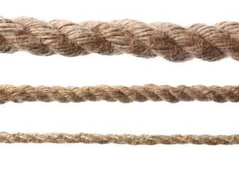 Set of durable hemp ropes on white background