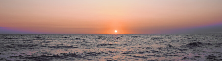 Beautiful panorama of sky over sea at sunset. Banner design