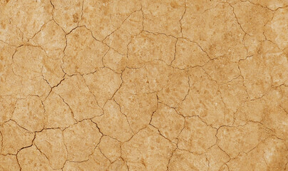 Fototapeta premium Cracked ground background in the top view for graphic design or wallpaper