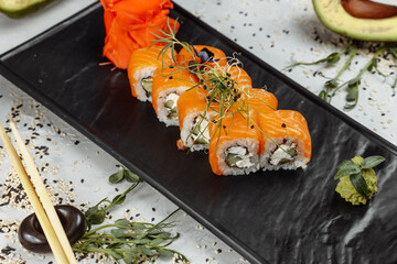 Sushi Philadelphia on a stone decorative plate