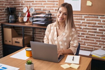 Young caucasian woman business worker using laptop working at office