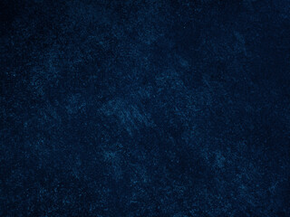 Dark rough cement wall background for graphic design or wallpaper.