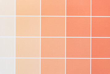 pastel orange paper pad sheet with paint chip element - macro lens, particular focus