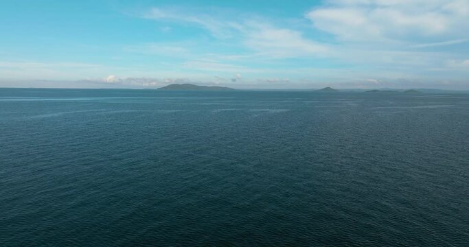 Islands and blue ocean against the sky and clouds. Philippines.