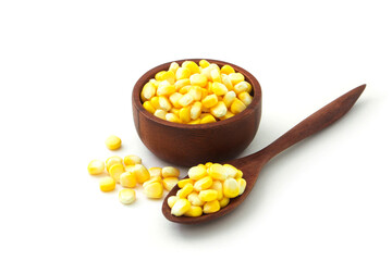 Sweet corn in wooden bowl and spoon isolated on white background.